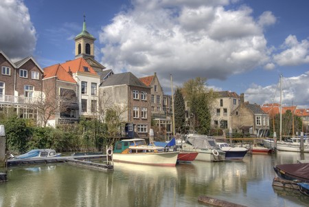 Canal with boats in Dordrecht, Hollandの写真素材