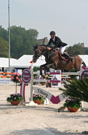 THE HAGUE, HOLLAND - AUGUST 31, 2008: Concours Hippique. Horse clearing a hurdle at the annual horse jumping competition at Westbroek Park.のeditorial素材