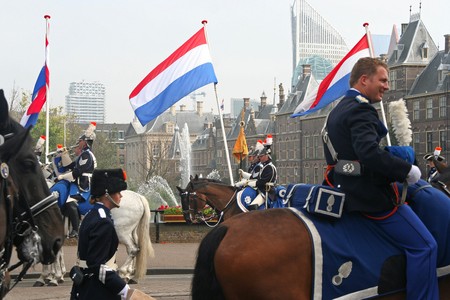 THE HAGUE, HOLLAND - SEPTEMBER 21, 2010: Cavalry and Dutch flags at the Parliament on Prinsjesdag (annual presentation of Government Policy to Parliament by the Queen) in The Hague, Holland on september 21のeditorial素材