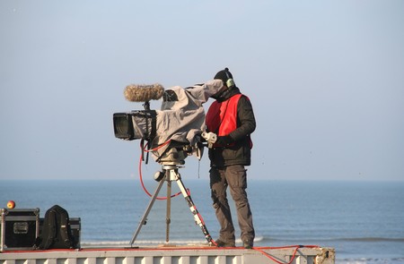 TV camera man filming at Red Bull motorcross race in Scheveningen, Holland on November 18, 2007のeditorial素材