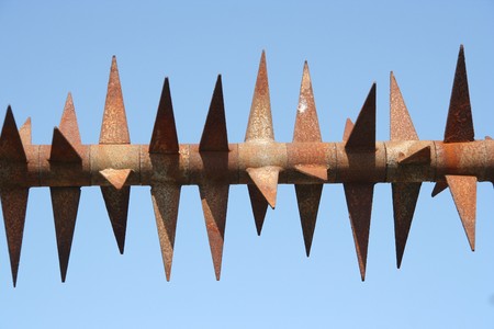 Rusty spikes on a fenceの写真素材