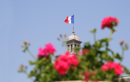 French flag on top of the Luxembourg Palace in Parisの写真素材