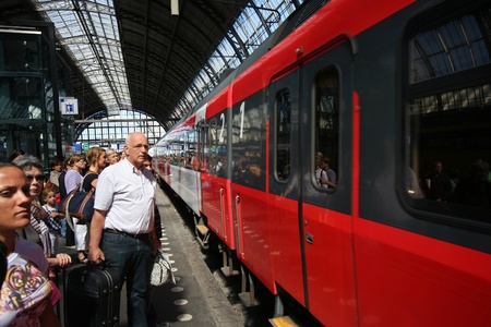 Train passengers on the platform at Amsterdam Centraal Station. Picture taken on July 30, 2010 in Amsterdam, Holland.のeditorial素材