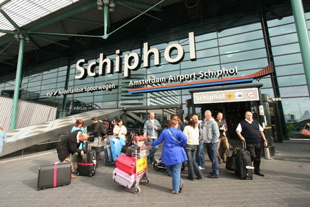 Travelers in front of the entrance of Schiphol Airport in Amsterdam, Holland. Picture taken on September 25, 2009のeditorial素材