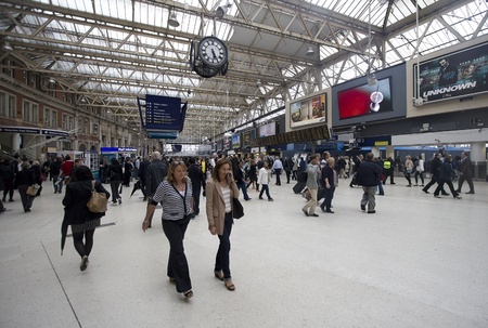 London, UK - July 21, 2011: Commuters walk in the central hall of Waterloo Railway station on July 21, 2011 in London, UK.のeditorial素材