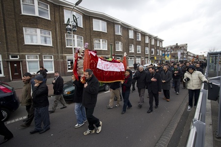 THE HAGUE, HOLLAND - DECEMBER 5: Shiite muslims carry Hussayns coffin in the parade of the Ashura festival on December 5, 2011 in The Hague, Hollandのeditorial素材