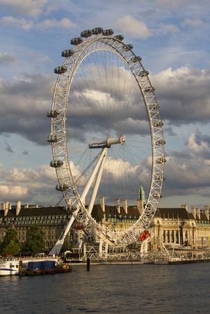 London, UK - July 24, 2011: The London Eye in the evening sun seen from across the Thames on July 24, 2011 in London, UKのeditorial素材