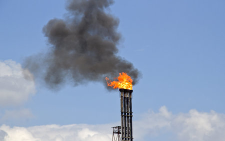Fire and smoke from an oil refinery pipe in Rotterdam industrial area in Holland