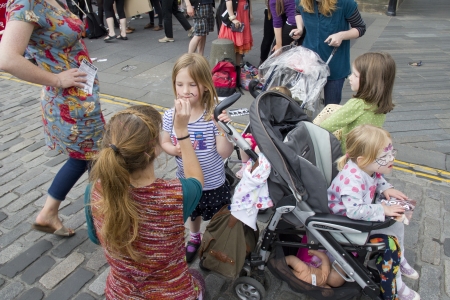 EDINBURGH, UK: AUGUST 2: Girl paints childrens faces on the Edinburgh Festival Fringe in Edinburgh, UK on August 2, 2012のeditorial素材