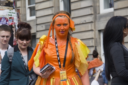 EDINBURGH, UK: AUGUST 2: Unidentified actor hands out flyers for the My Plaice/The Lake show by the Lincoln Company on the street at the Edinburgh Festival Fringe in Edinburgh, UK on August 2, 2012のeditorial素材