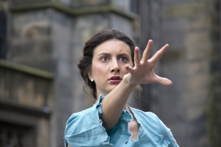 EDINBURGH: AUGUST 3: Unidentified member of the cast of the Fourth Monkey Company strikes a dramatic pose on the Royal Mile, the main street of Edinburgh, at the Edinburgh Festival Fringe on August 3, 2012 in Edinburgh.のeditorial素材