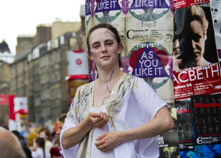 EDINBURGH, UK: AUGUST 2: Unidentified actor strikes a dramatic pose on the street at the Edinburgh Festival Fringe in Edinburgh, UK on August 2, 2012のeditorial素材