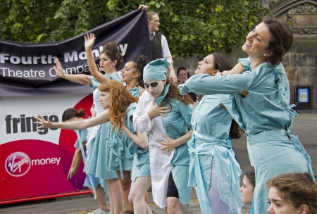 EDINBURGH: AUGUST 3: Cast of Antigone by the Emanuel Theatre Company perform on the Royal Mile, the main street of Edinburgh, at the Edinburgh Festival Fringe on August 3, 2012 in Edinburgh.のeditorial素材