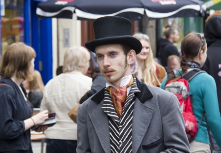 EDINBURGH, UK: AUGUST 2: Unidentified actor as Victorian gentleman hands out flyers in the street at the Edinburgh Festival Fringe in Edinburgh, UK on August 2, 2012のeditorial素材