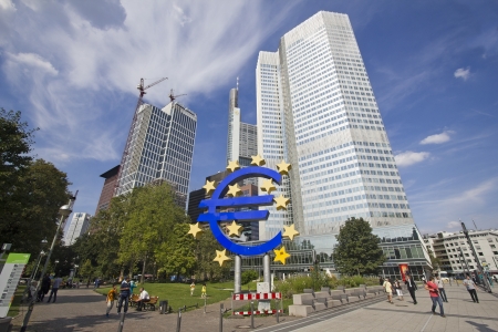 Frankfurt, Germany - August 29, 2013  People walk around the Euro sign in a park among modern office towers in Frankfurt, Germany on August 29, 2013 のeditorial素材