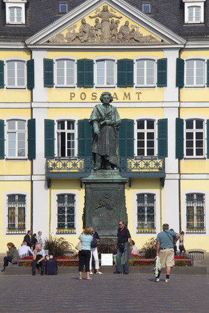 Bonn, Germany - August 30, 2013  People take pictures underneath the historical statue of Ludiwg von Beethoven in front of the post office on a town plaza in Bonn, Germany on August 30, 2013 のeditorial素材