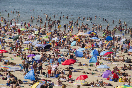 Scheveningen, Holland - August 2  People enjoying on a crowded beach at Scheveningen, Holland on August 2, 2013 のeditorial素材