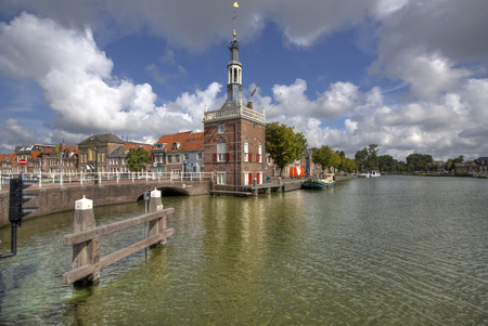 Historical customs tower at a canal in Alkmaar, Hollandの写真素材