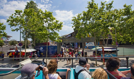 Barcelona, Spain - May 25 2015: Tourists on a bus drive past the stadium of FC Barcelona in Barcelona in Spain on May 25 2015.のeditorial素材