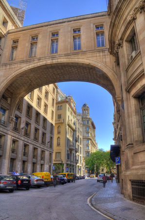 Barcelona, Spain - May 23, 2015: People and parked cars in downtown Barcelona, Spain on May 23, 2015.のeditorial素材