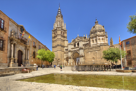 Toledo, Spain - June 1, 2016: Tourists walk near the pond in front of the cathedral in Toledo, Spain on June 1, 2016のeditorial素材