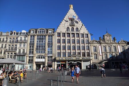 Lille, France - May 26, 2017: People walk in front of the La Voix du Nord department store on the Place du General de Gaulle square in front of the old Stock Exchange building in Lille, France on May 26, 2017のeditorial素材