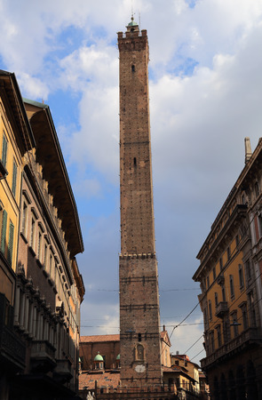 Tall medieval tower of Bologna, Italy, seen from the Via Rizzoli streetのeditorial素材