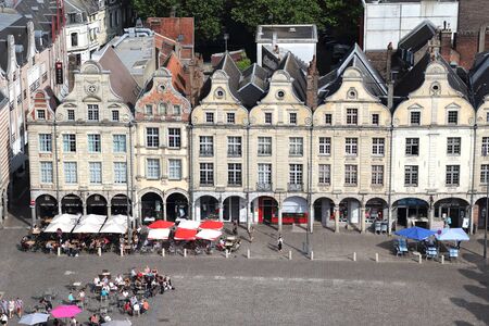 Arras, France - May 28, 2017: People sit at restaurants in historical Flemish style houses on the Place des Heros market place or town square in Arras in France on May 28, 2017のeditorial素材