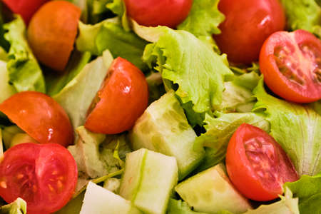 Fresh and tasty salad with cherry tomatoes and cucumber close up detailの写真素材