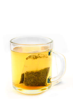 Tea in glass cup with teabag isolated on white backgroundの写真素材