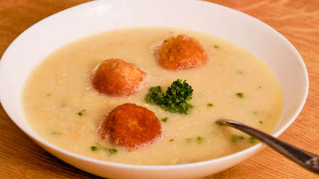 Tasty czech Christmas fish soup with fried ballsの写真素材
