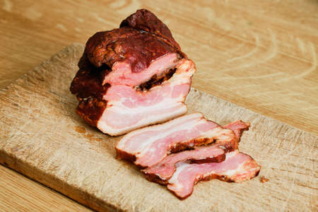 Tasty bacon meat on cutting boardの写真素材