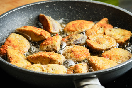 Preparing freshly fried mushrooms on frying panの写真素材