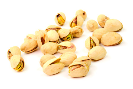 Tasty pistachio nut in a nutshell isolated on white backgroundの写真素材