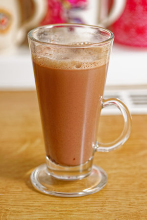 Tasty hot chocolate drink in tall glassの写真素材