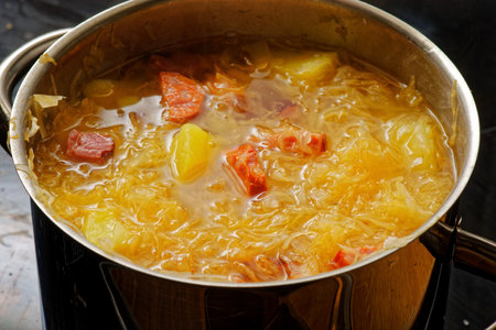 Preparing tasty homemade cabbage soup in cooking potの写真素材
