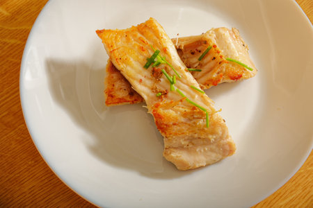 Tasty carp fish steak on white plateの写真素材