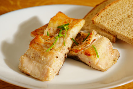 Tasty carp fish steak on white plateの写真素材