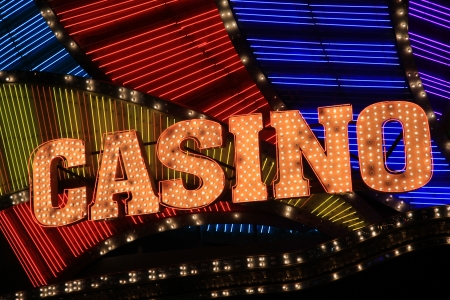 Bright casino sign lit with bulbs and neon lights のeditorial素材