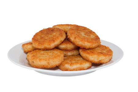 Hash browns on white plate. Image is isolated on white background, contains clipping path.の写真素材