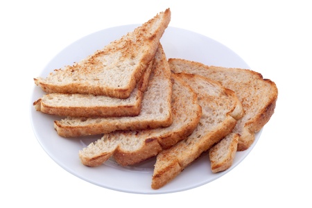 Six pieces of toast on white plate. Image is isolated on white background, contains clipping path.の写真素材