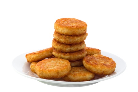 Hash browns on white plateの写真素材