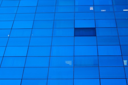 Blue windows of skyscraper office building background.の写真素材
