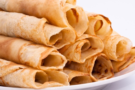 Detail of rolled crepes on white background.の写真素材