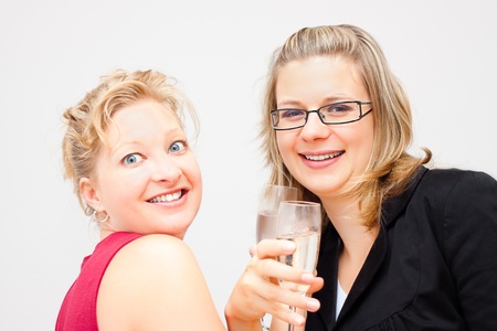 Two young business women enjoying party.の写真素材