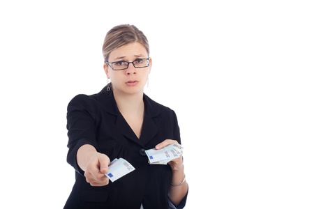 Unhappy young woman giving away Euro bank notes, isolated on white background.の写真素材