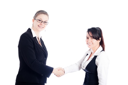 Two happy business women handshake, isolated on white background.の写真素材