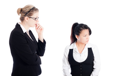 Two business women focused on inventing new ideas. Isolated on white background.の写真素材