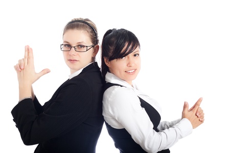 Successful business women team posing, isolated on white background.の写真素材