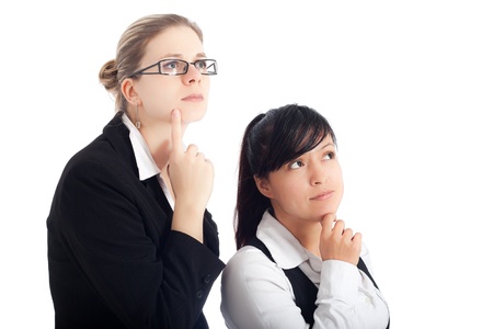 Two young business women focused on new visions, isolated on white background.の写真素材